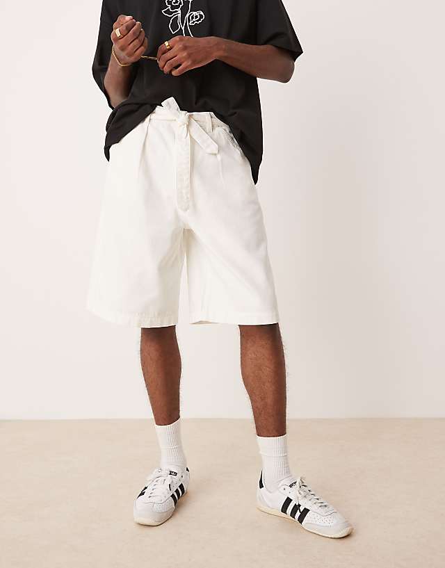 asos ASOS DESIGN long length pleated shorts with self tie in ecru