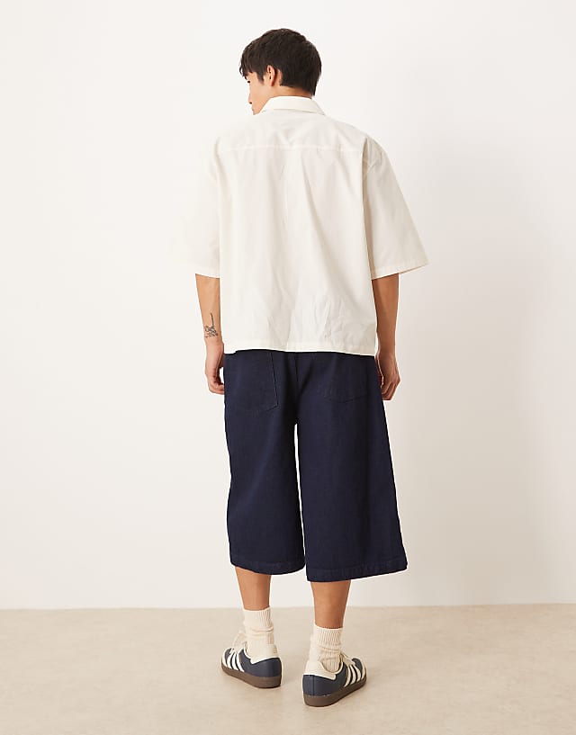 Asos ASOS DESIGN Longer Length Pleated Denim Jort In Raw Wash