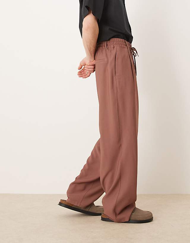 Asos ASOS DESIGN Loose Fit Smart Trousers With Wide Waistband And Elasticated Waist In Brown