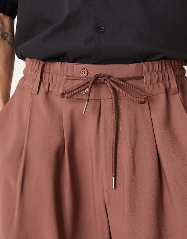 Asos ASOS DESIGN Loose Fit Smart Trousers With Wide Waistband And Elasticated Waist In Brown