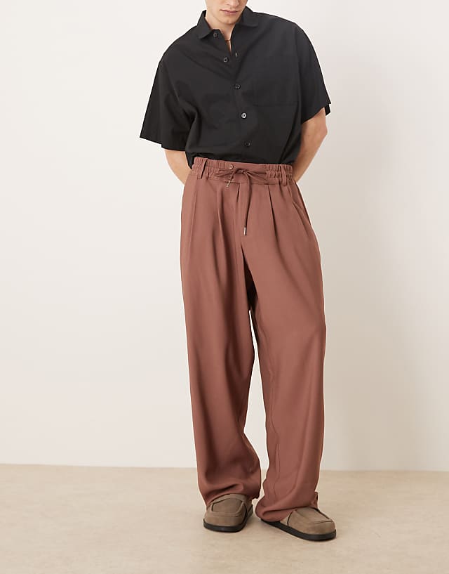 asos ASOS DESIGN loose fit smart trousers with wide waistband and elasticated waist in brown