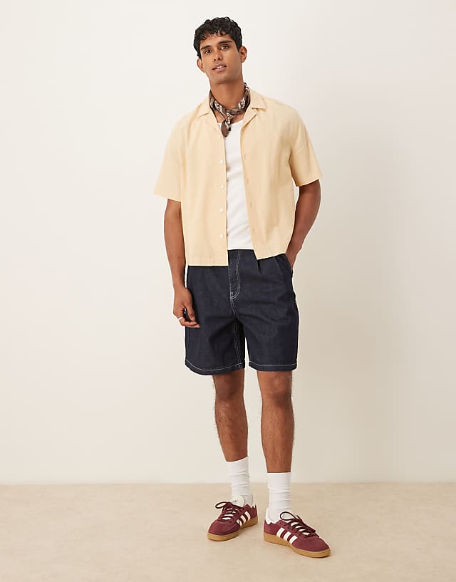 Asos ASOS DESIGN Mid Length Denim Jort With Double Pleats In Raw Wash
