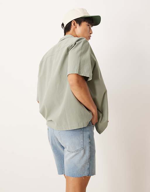 Asos ASOS DESIGN Mid Length Slim Denim Shorts With Rips In Light Wash Blue