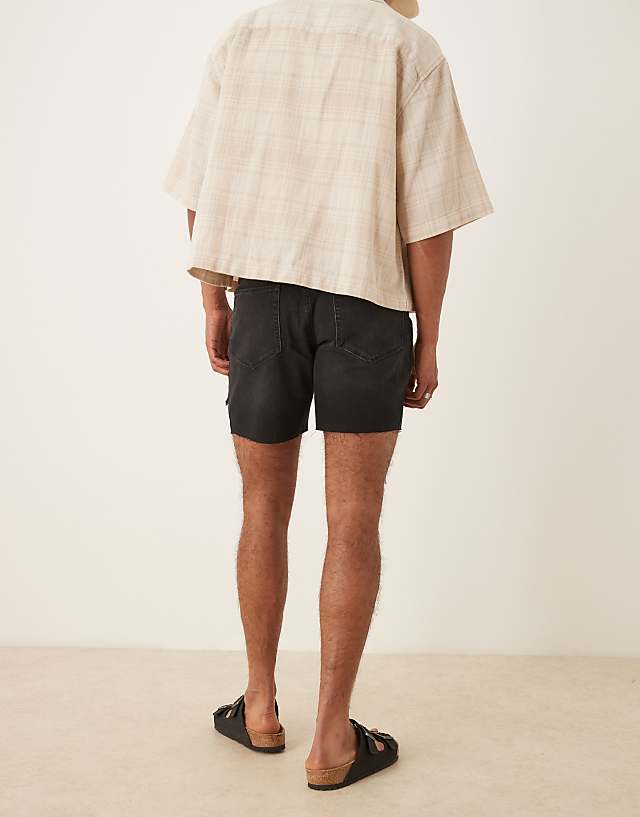Asos ASOS DESIGN Mid Length Slim Denim Shorts With Rips In Black
