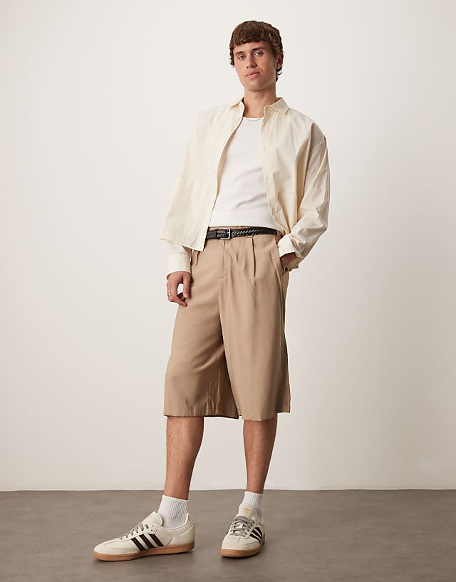 asos ASOS DESIGN oversized bemuda shorts with pleat details in sand