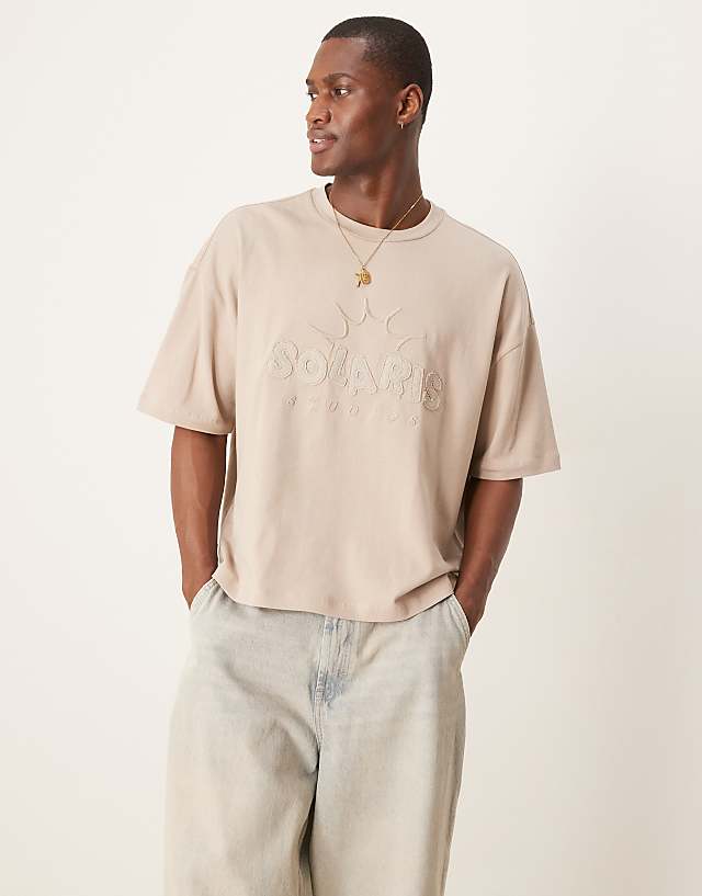 asos ASOS DESIGN oversized boxy 240gsm heavweight t-shirt in with applique chest print in beige