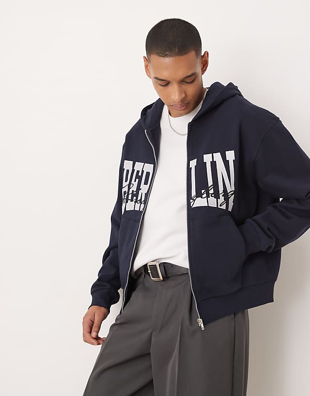 asos ASOS DESIGN oversized boxy zip through hoodie with berlin print in navy