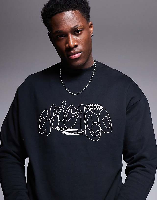 asos ASOS DESIGN oversized crew with city print in black