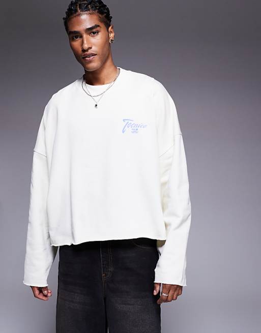 asos ASOS DESIGN oversized cropped sweatshirt with raw hem with chest print in white