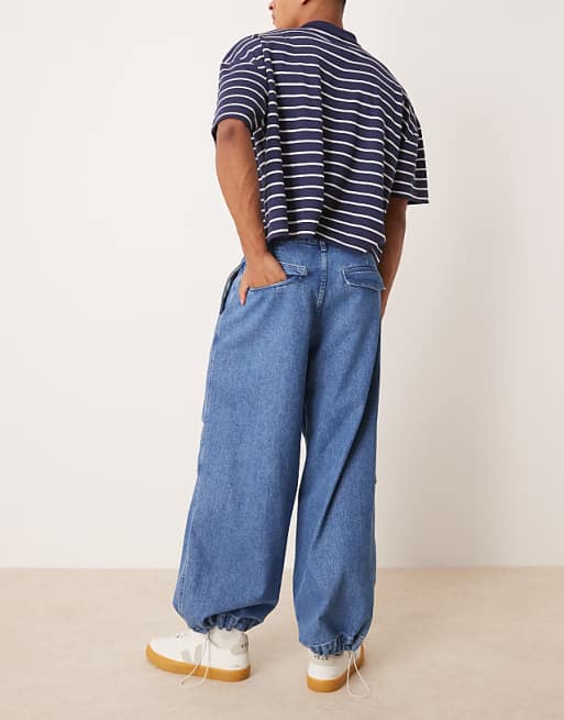 Asos ASOS DESIGN Oversized Parachute Jeans With Drawstring And Contrast Stitch In Mid Wash Blue