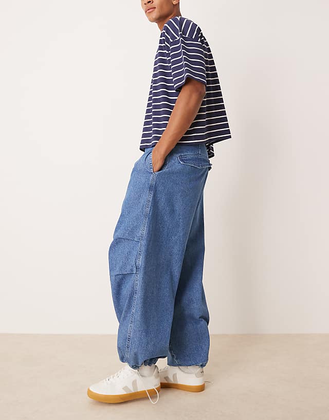 Asos ASOS DESIGN Oversized Parachute Jeans With Drawstring And Contrast Stitch In Mid Wash Blue