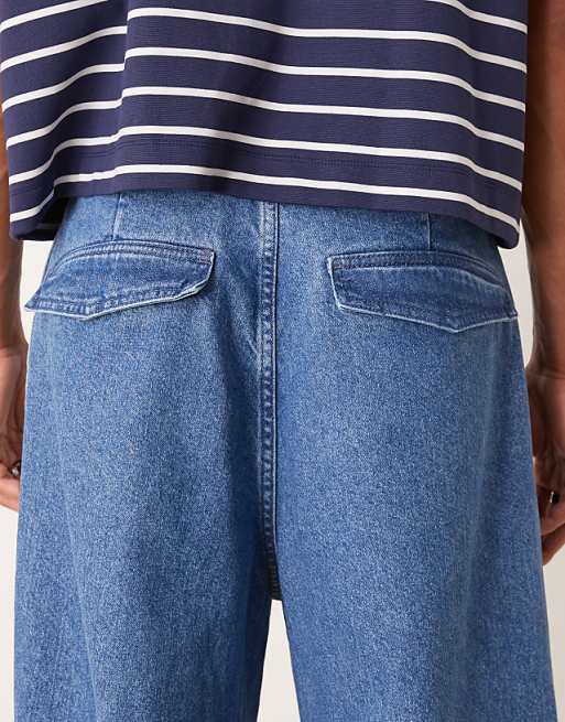 Asos ASOS DESIGN Oversized Parachute Jeans With Drawstring And Contrast Stitch In Mid Wash Blue