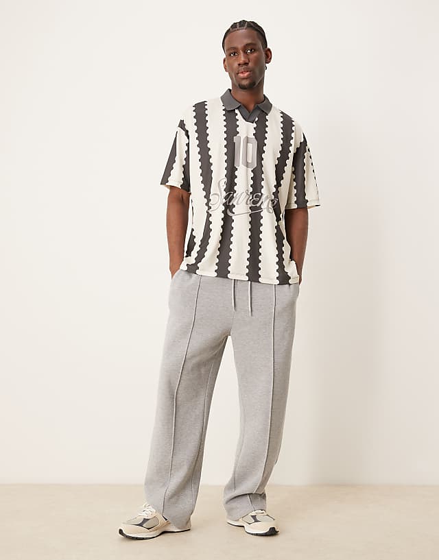 Asos ASOS DESIGN Oversized Polo With Sports Graphic And All Over Print