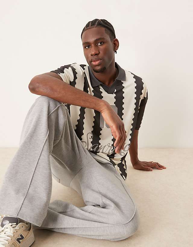 Asos ASOS DESIGN Oversized Polo With Sports Graphic And All Over Print