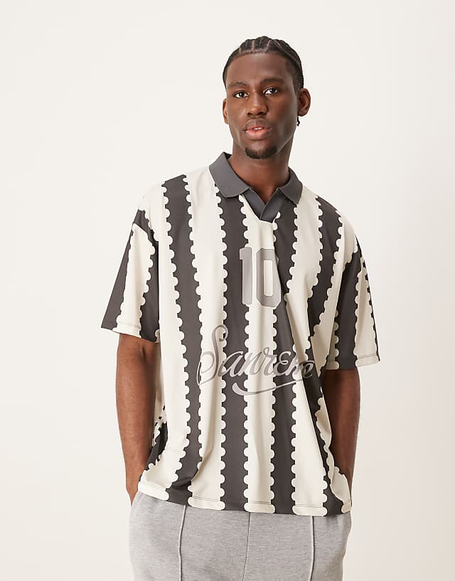 asos ASOS DESIGN oversized polo with sports graphic and all over print