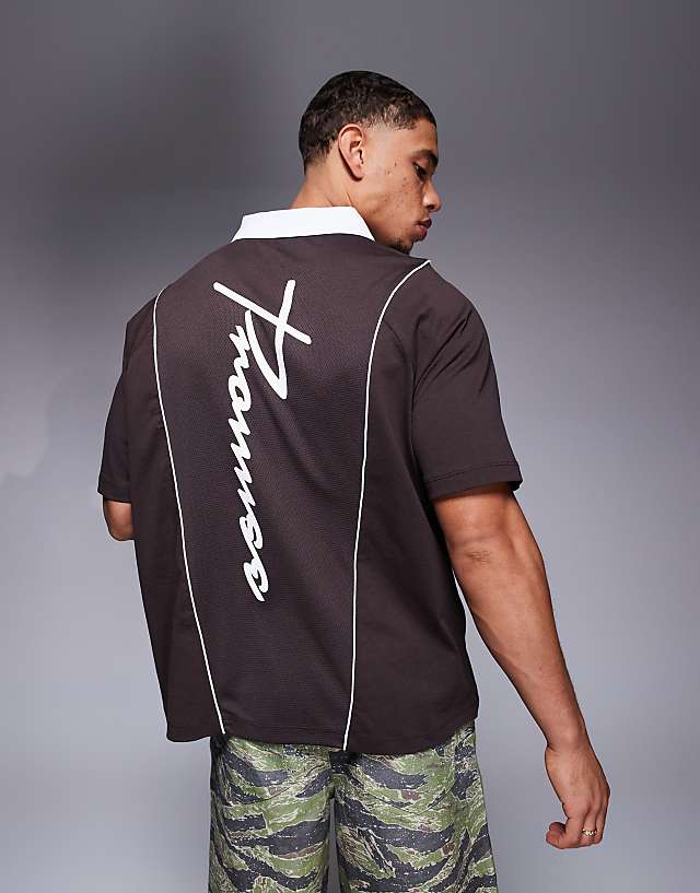 Asos ASOS DESIGN Oversized Polo With Sports Graphics And Airtex Panelling In Brown
