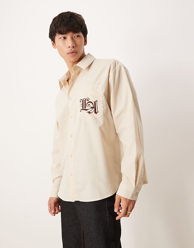 Asos ASOS DESIGN Oversized Shirt With Chest Embroidery In Beige