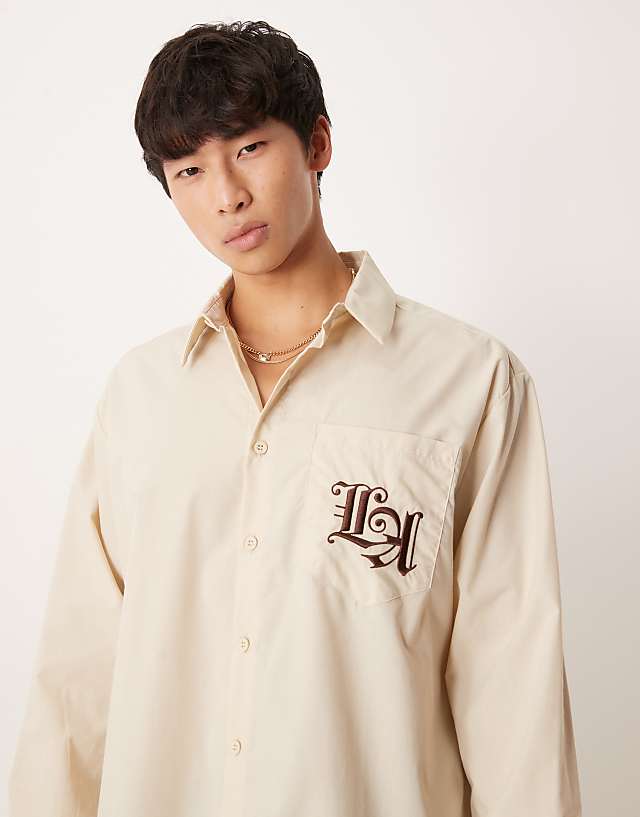 asos ASOS DESIGN oversized shirt with chest embroidery in beige