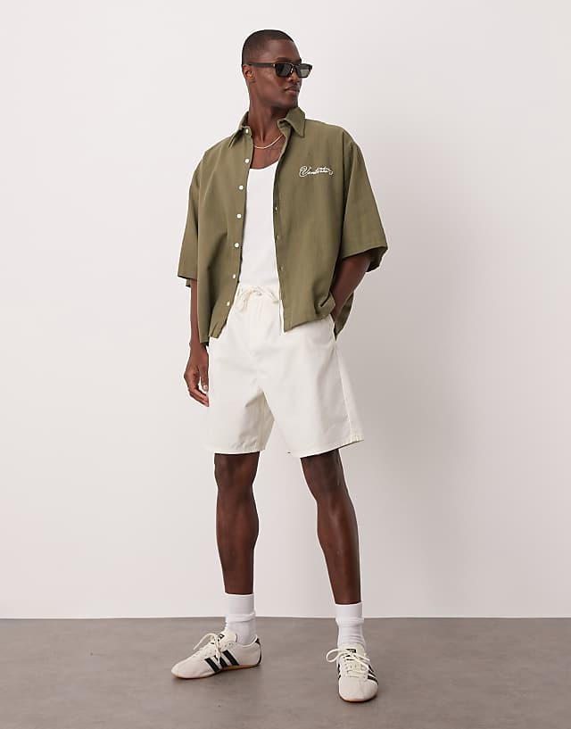 Asos ASOS DESIGN Oversized Short Sleeved Shirt With Chest Embroidery Detail In Khaki Linen Look