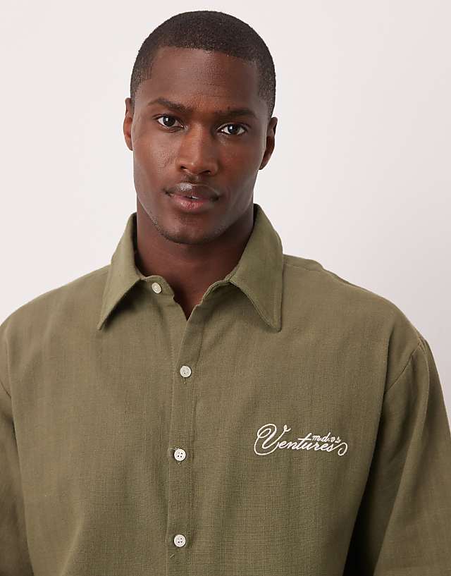Asos ASOS DESIGN Oversized Short Sleeved Shirt With Chest Embroidery Detail In Khaki Linen Look