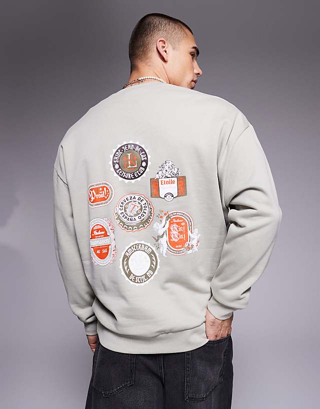 asos ASOS DESIGN oversized sweatshirt with beer mat prints in grey