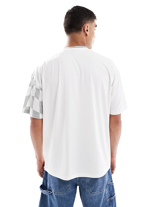Asos ASOS DESIGN Oversized T-shirt With High Build Sports Graphic In Printed Sports Fabric