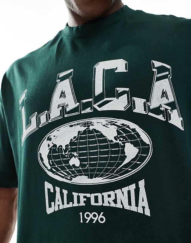 Asos ASOS DESIGN Oversized T-shirt With Varsity Graphic In Dark Green