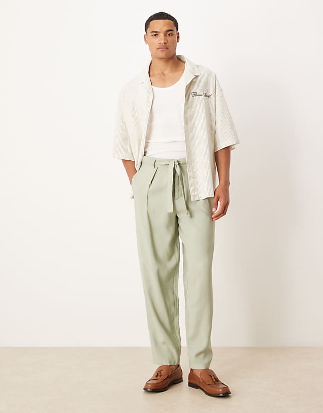 asos ASOS DESIGN oversized tapered smart trousers with belt detail in green
