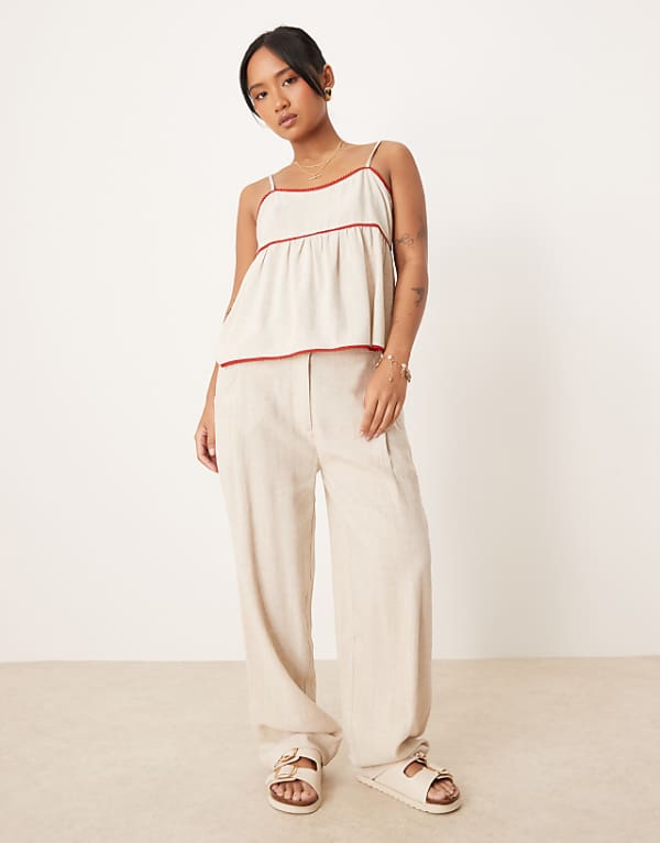 asos ASOS DESIGN Petite pleat front tapered trousers with linen in stone