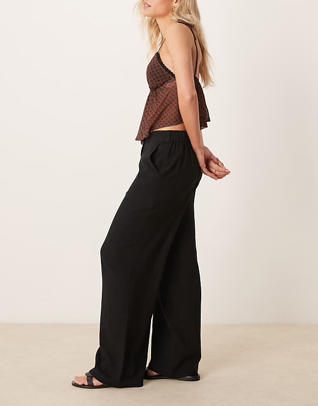 Asos ASOS DESIGN Petite Relaxed Straight Leg Trousers With Linen In Black