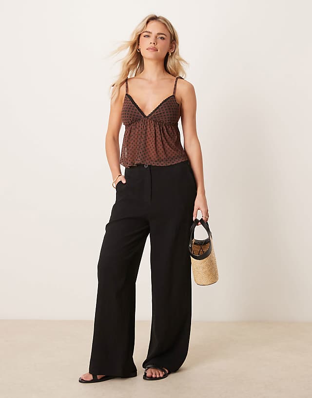 asos ASOS DESIGN Petite relaxed straight leg trousers with linen in black