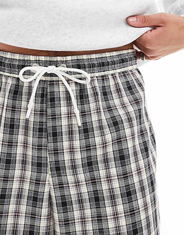 Asos ASOS DESIGN Pull On Smart Wide Leg Check Trousers In Black