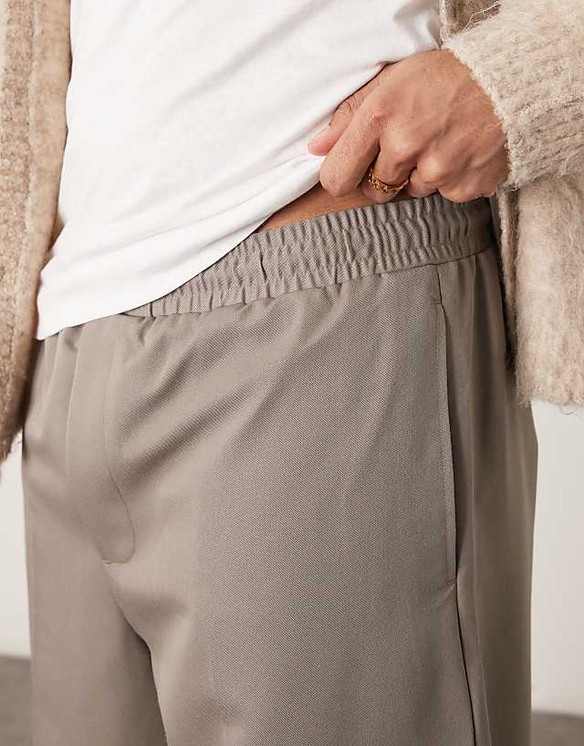 Asos ASOS DESIGN Pull On Smart Wide Leg Trousers With Hem Poppers In Muted Khaki