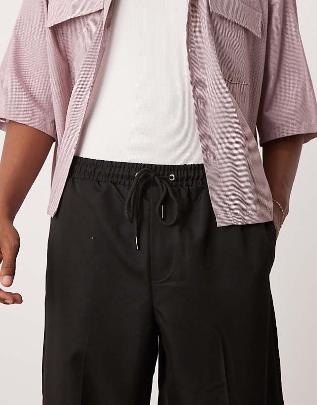 Asos ASOS DESIGN Pull On Smart Wide Leg Trousers With Hem Poppers In Black