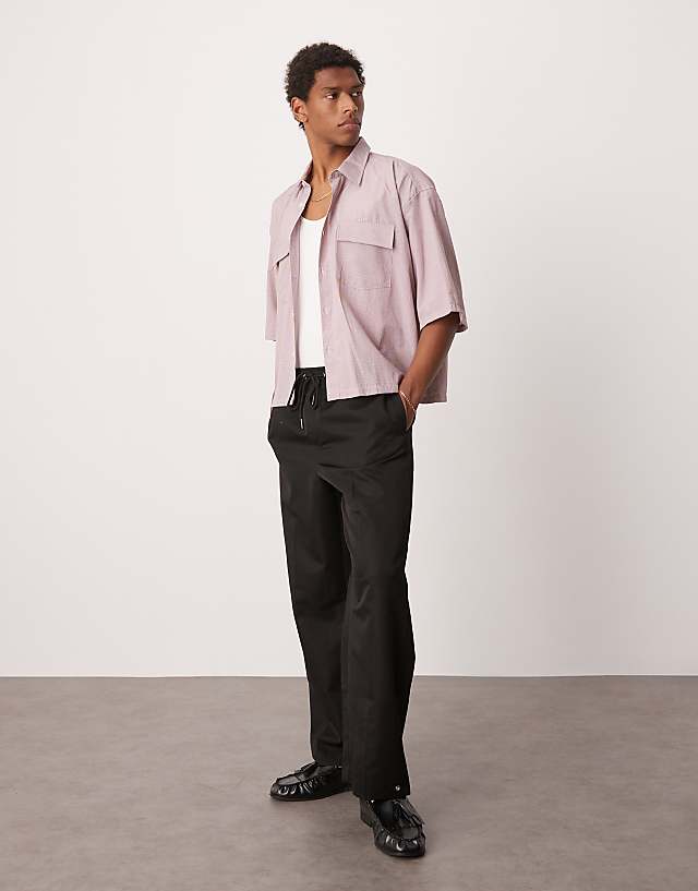 asos ASOS DESIGN pull on smart wide leg trousers with hem poppers in black