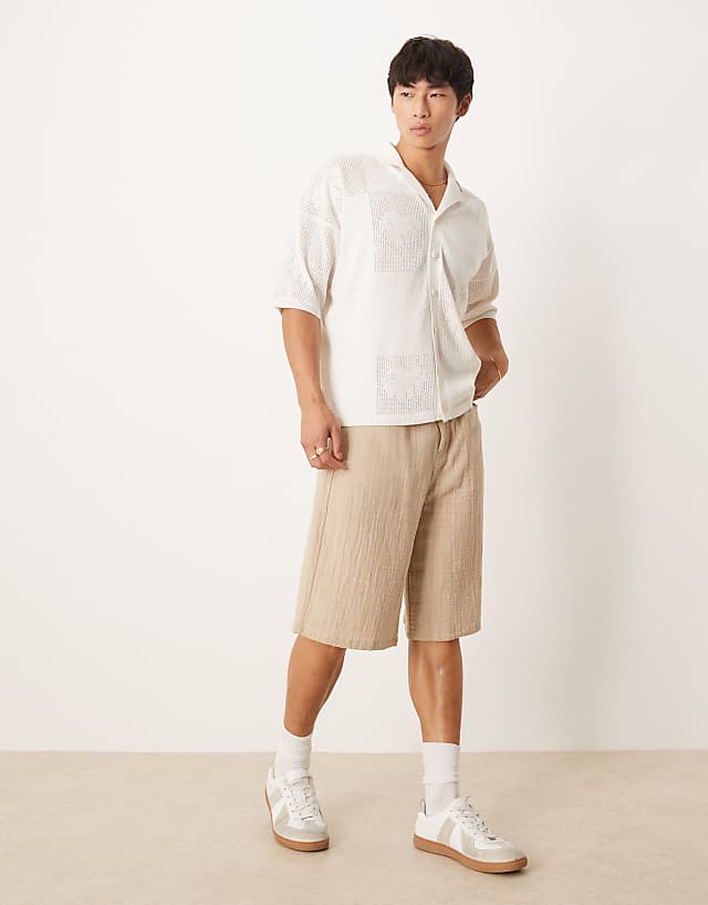 Asos ASOS DESIGN Relaxed Knitted Textured Floral Button Through Polo In Cream