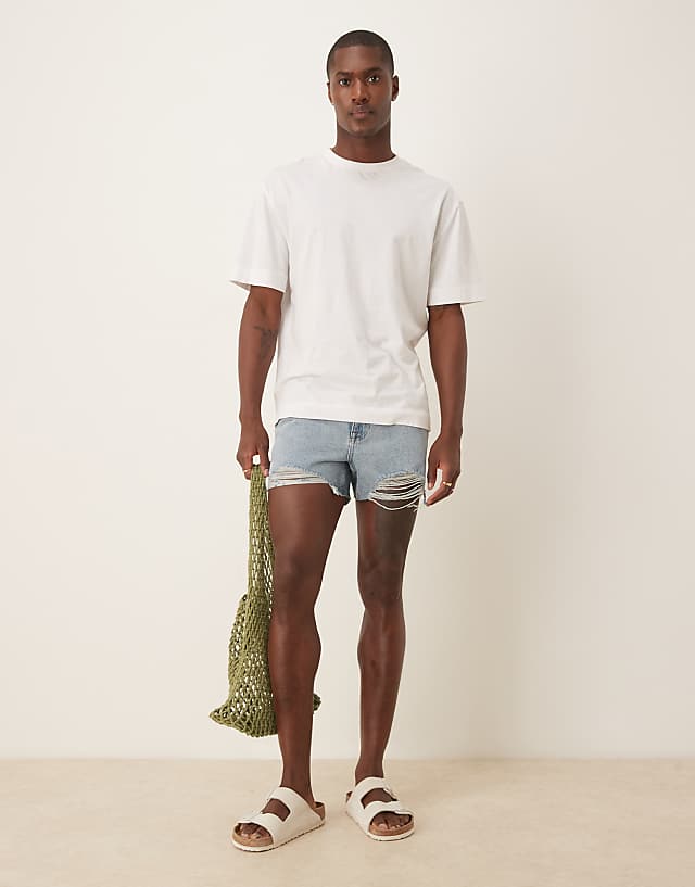 Asos ASOS DESIGN Shorter Length Straight Fit Denim Shorts With Rip Detail In Light Wash Blue