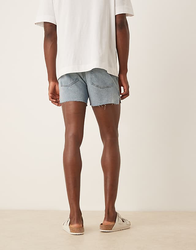 Asos ASOS DESIGN Shorter Length Straight Fit Denim Shorts With Rip Detail In Light Wash Blue