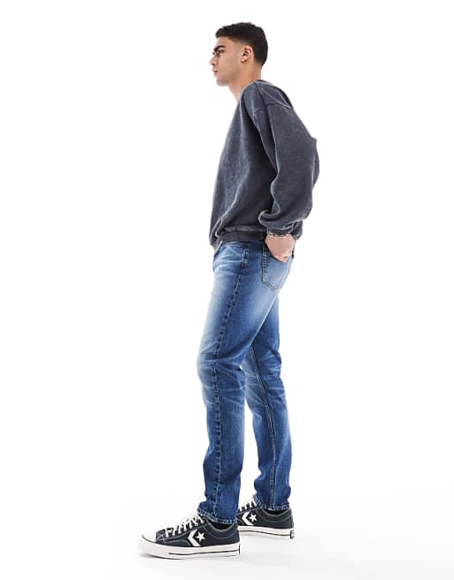 Asos ASOS DESIGN Skinny Jeans With Tint In Mid Wash Blue