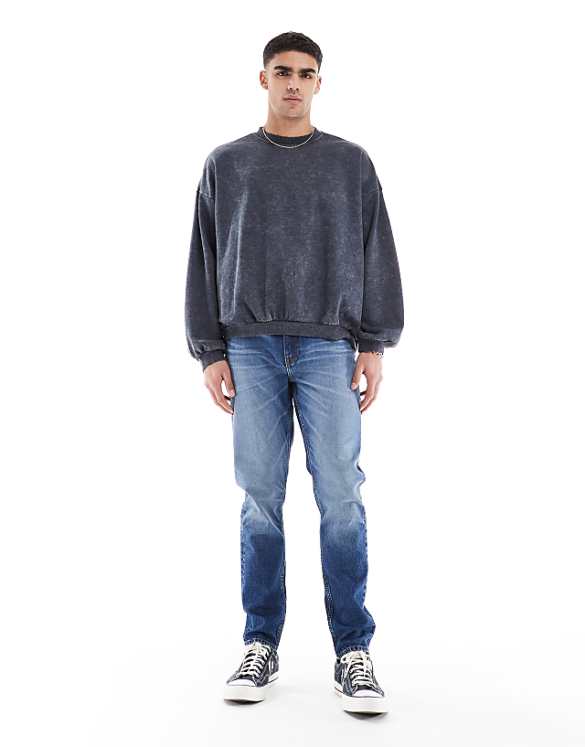 asos ASOS DESIGN skinny jeans with tint in mid wash blue