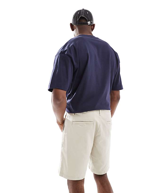 Asos ASOS DESIGN Slim Regular Length Chino Shorts In Stone