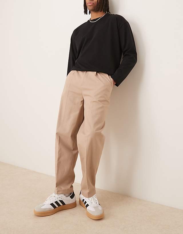 asos ASOS DESIGN smart oversized tapered 100% cotton chino trousers with side adjusters in light stone