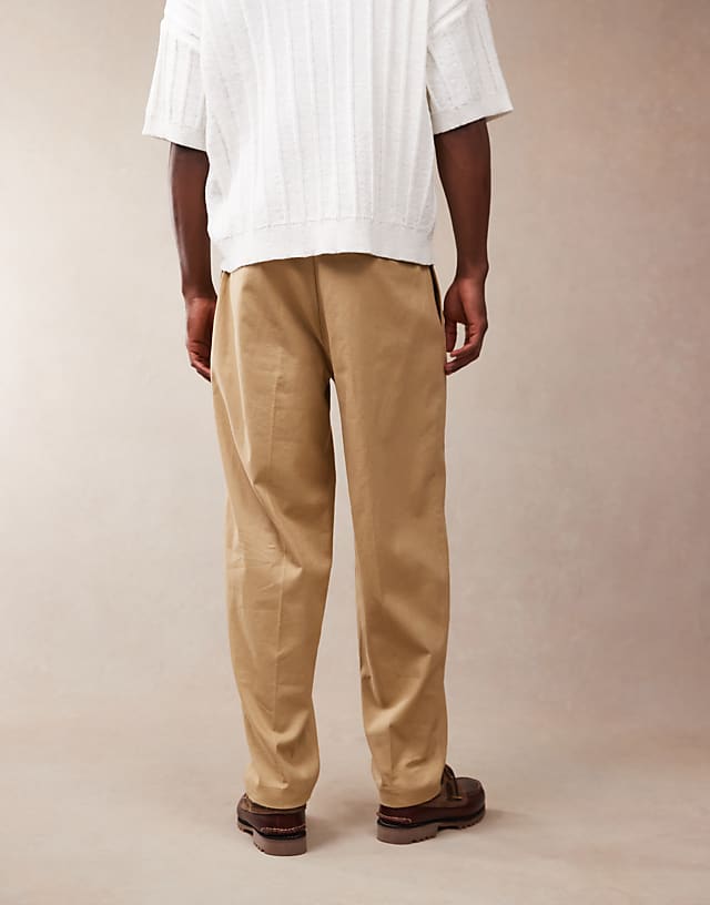 Asos ASOS DESIGN Smart Oversized Tapered Linen Blend Trousers With Front Pleat In Camel