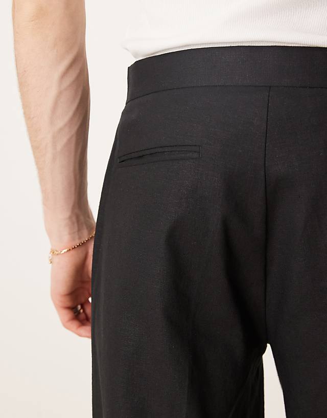 Asos ASOS DESIGN Smart Oversized Tapered Linen Blend Trousers With Front Pleat In Black