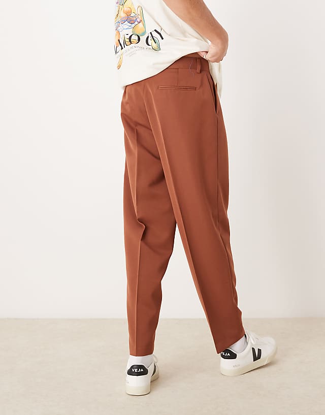 Asos ASOS DESIGN Smart Oversized Tapered Trousers With Front Pleat In Rust