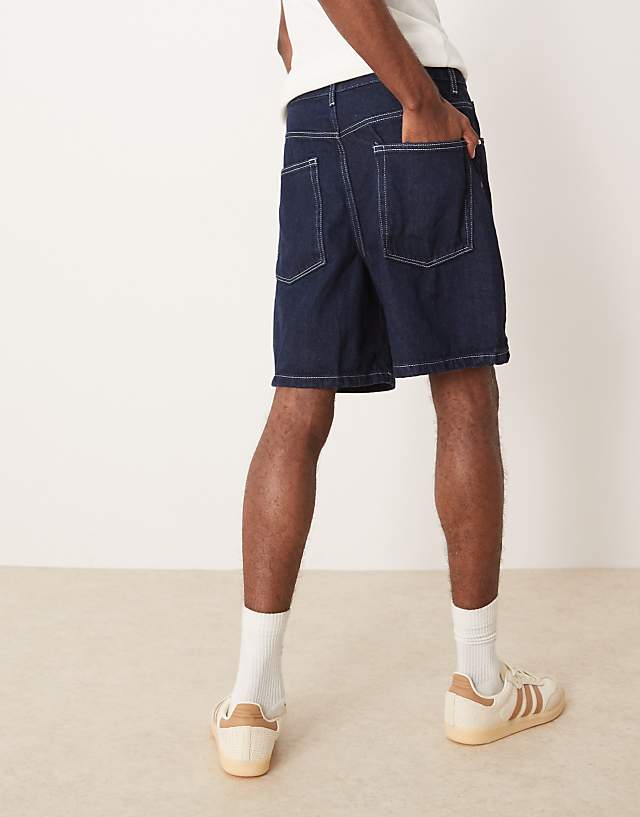 Asos ASOS DESIGN Standard Length Denim Jort In Indigo