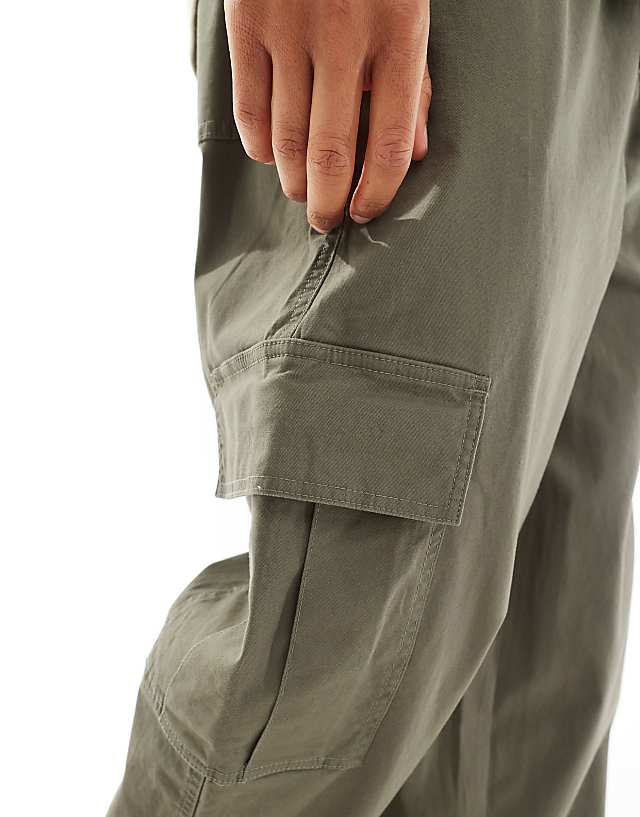 Asos ASOS DESIGN Super Baggy Cargo Trousers With Elasticated Waist In Washed Green