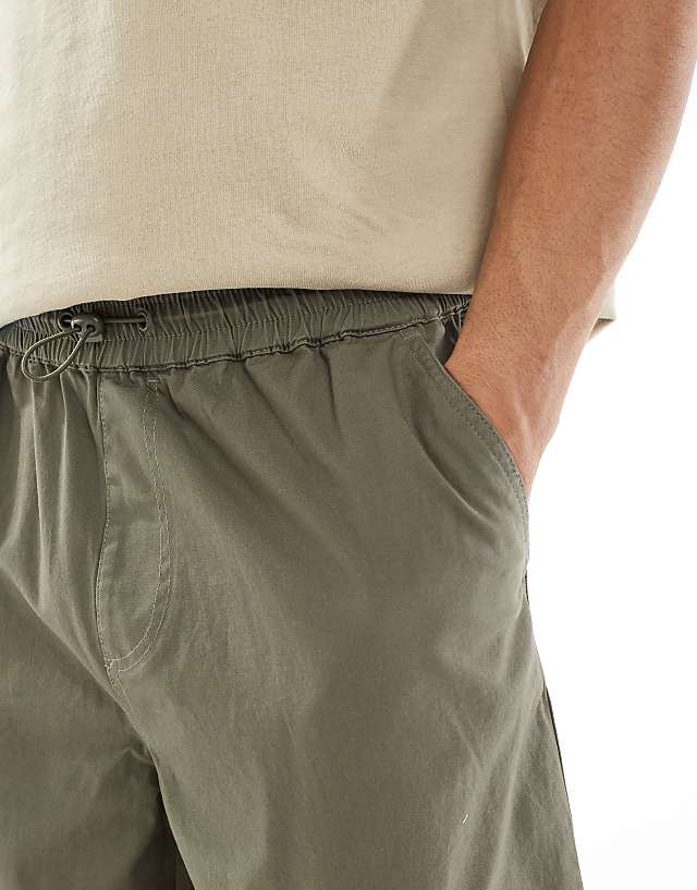 Asos ASOS DESIGN Super Baggy Cargo Trousers With Elasticated Waist In Washed Green