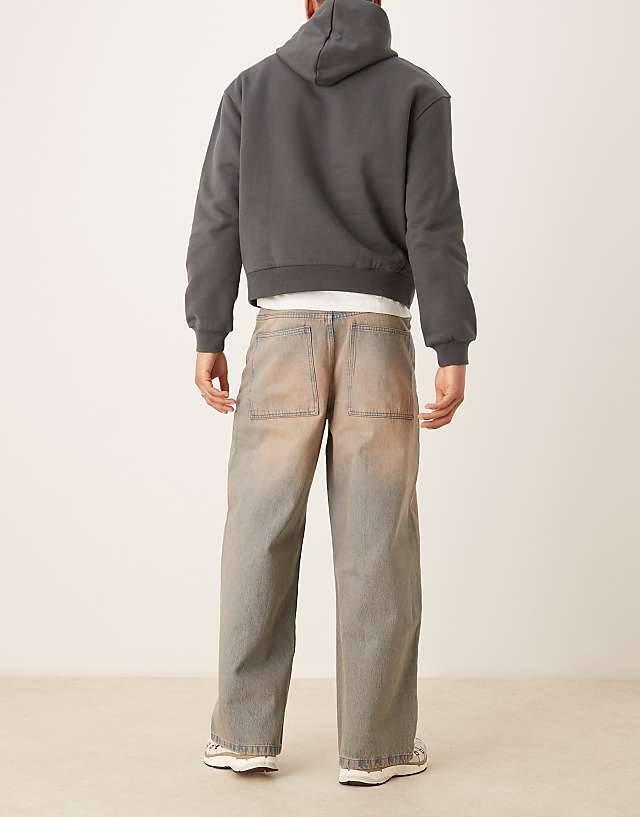 Asos ASOS DESIGN Super Baggy Jeans With Heavy Red Tint In Mid Wash Blue