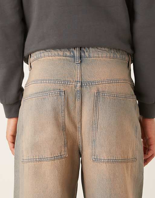 Asos ASOS DESIGN Super Baggy Jeans With Heavy Red Tint In Mid Wash Blue